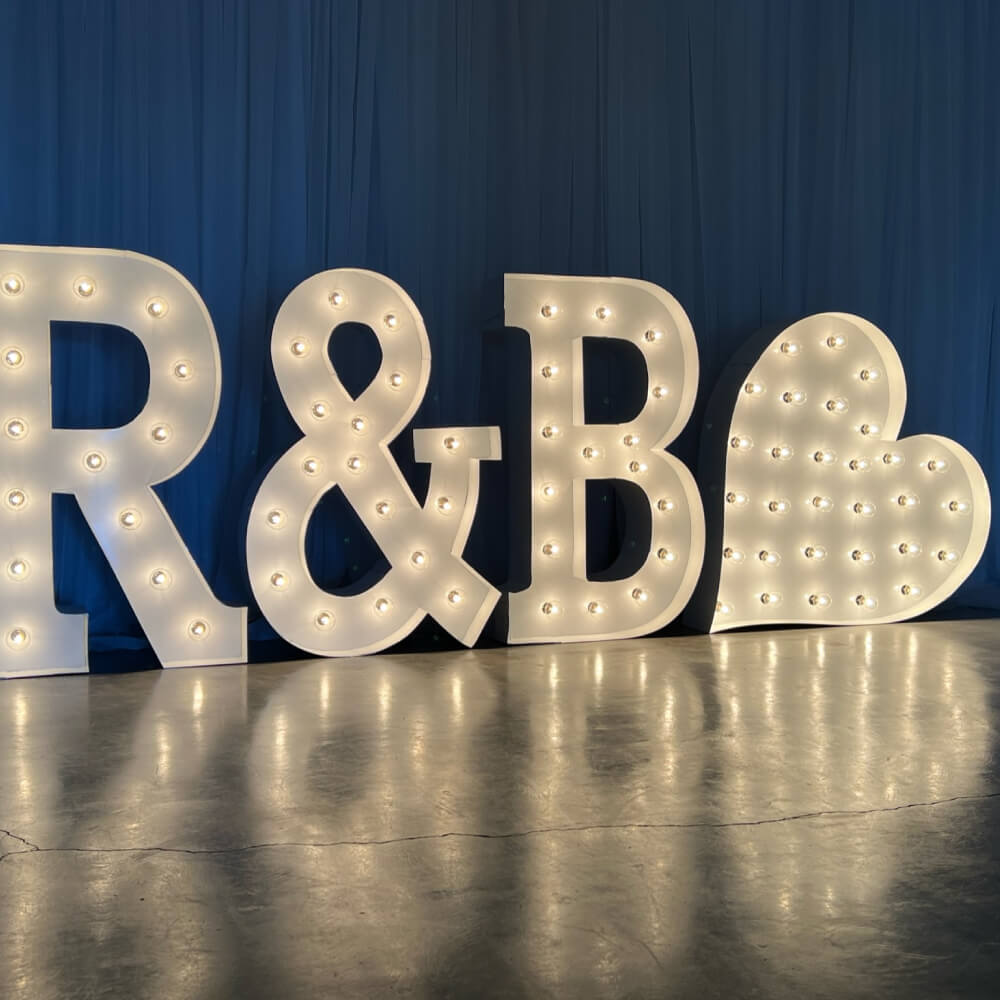 R&B with a heart lit up marquee letters